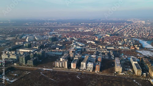 Aerial drone footage of residential and office buildings of Pipera in Bucharest as seen from above. Flyover shot of the neighbourhoods of Voluntari and Pipera in winter filmed by a drone.
 photo