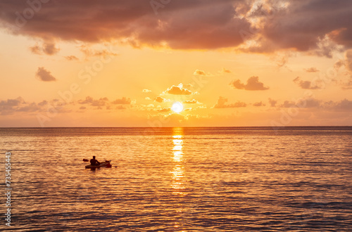 Kayaking at sunset near Beau Vallon Beach, Island Mahé, Republic of Seychelles, Africa.