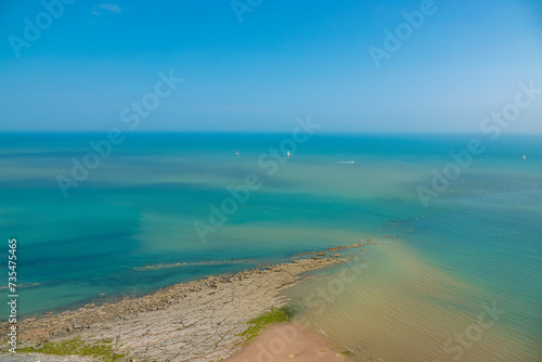 Wallpaper Mural A rocky ridge on the edge of a cape stretching out towards turquoise blue sea Torontodigital.ca