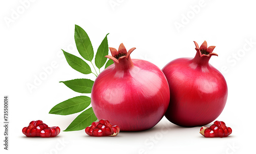 Fresh ripe pomegranate with green leaves isolated on white background.