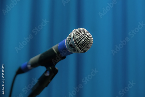 Microphone On Pedestal With Blue Theater Curtain In The Background Show Backstage photo