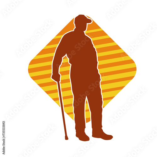 Silhouette of an elderly man standing with walking cane.