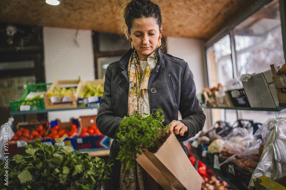 Woman grocery shopping at the local store with paper bag Woman grocery shopping at the local store with paper bag