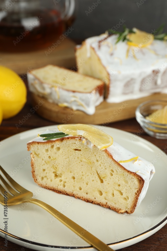 Piece of tasty lemon cake with glaze served on table, closeup Piece of tasty lemon cake with glaze served on table, closeup