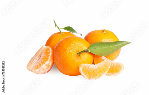 Fresh ripe juicy tangerines with green leaves isolated on white
