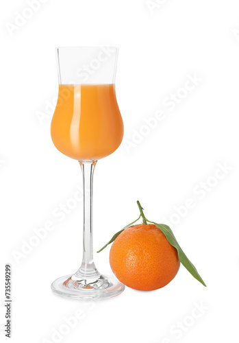 Glass with tasty tangerine liqueur and fresh fruit isolated on white