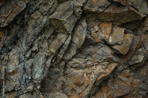 Stone rock mountain cave granite basalt mineral surface texture background. Dark gray brown beige. Crack cracked broken crumbled crushed. Close-up. Geometric Shape. Block. 3d.