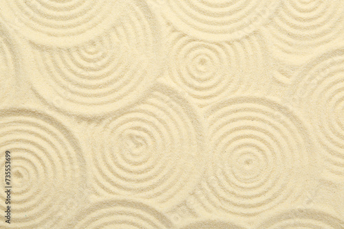 Zen rock garden. Circle patterns on beige sand  top view