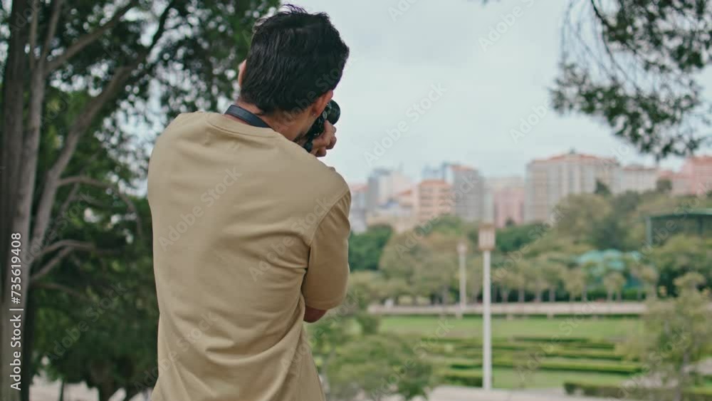 Guy taking picture town view on professional camera. Unrecognizable photographer Guy taking picture town view on professional camera. Unrecognizable photographer