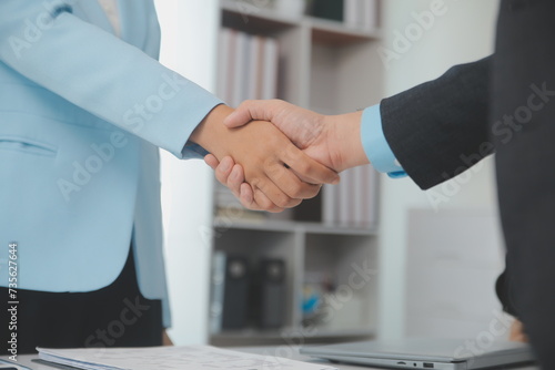 Close up view of job interview in office, focus on resume writing tips, employer reviewing good cv of prepared skilled applicant, recruiter considering application, hr manager making hiring decision © Kansuda