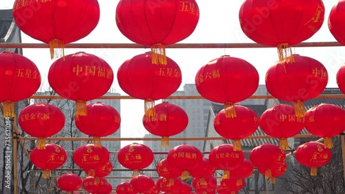 Chinese red lantern decoration hung during festivals.Traditional red asian chinese culorful lantern in the courtyard of a Buddhist chinese temple. Textile and paper lanterns, decorated with ornament photo