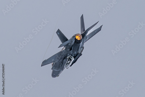  F-35 fighter aircraft, missile doors open, with afterburner photo