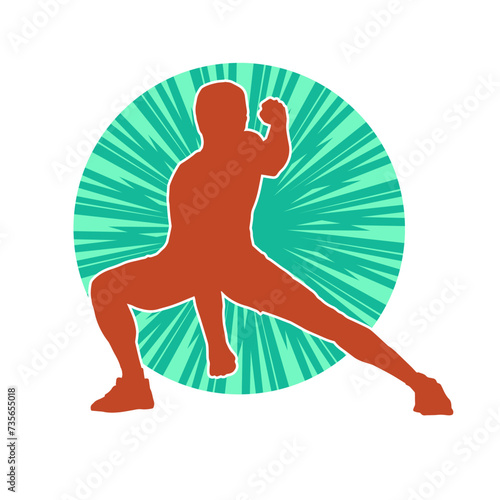 Silhouette of a sporty male in action pose at the gym. Silhouette of a slim man in aerobics workout pose.