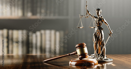 Legal Concept: Themis is the goddess of justice and the judge's gavel hammer as a symbol of law and order on the background of books