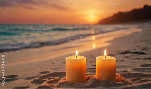two burning candels on beautiful sand beach during romantic sunset, miracle candles on blurred seascape background, celebrate an event for two in nature, party on the beach concept with copy space