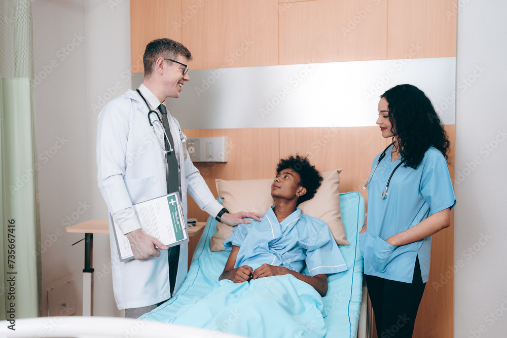 Fototapeta premium Professional male doctor in white medical uniform talk discuss results or symptoms with female patient, man GP or physician consult client give recommendation at meeting in hospital, health insurance