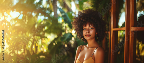 portrait of beautiful afro girl at beach house