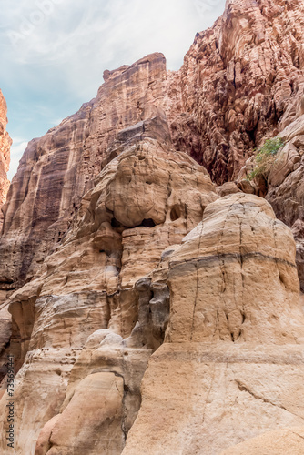 The extraordinary beauty of high mountains on sides of gorge of tourist route of the gorge Wadi Al Ghuwayr or An Nakhil and the wadi Al Dathneh near Amman in Jordan