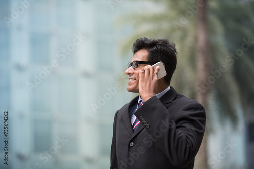 Indian business man talking on his Smart phone.