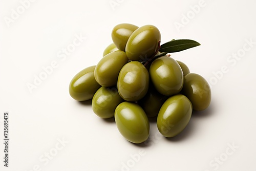 pile of fresh green olives with branch leafs 