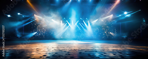 empty stage is set under dramatic blue lighting