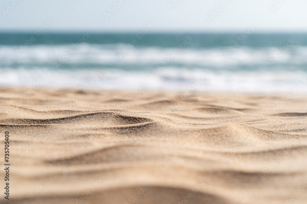 Beautiful sandy beach seascape background sand texture. Blur bokeh sea, ocean, sky and sand focused Beautiful sandy beach seascape background sand texture. Blur bokeh sea, ocean, sky and sand focused