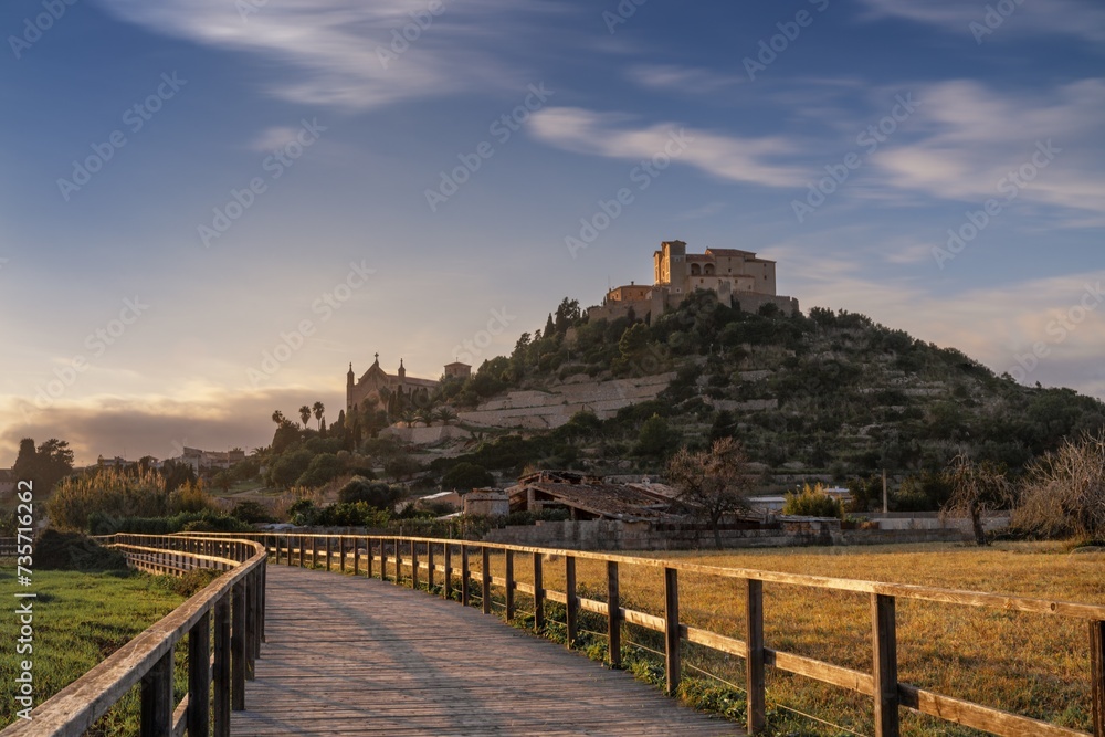 view of the landmark Arta Sanctuary on the hill in warm evening light