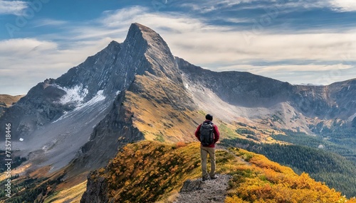 Autumn Ascent: A Lone Hiker Conquers Majestic Heights"