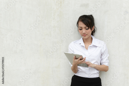 Asian Business woman using a Touch-Pad PC