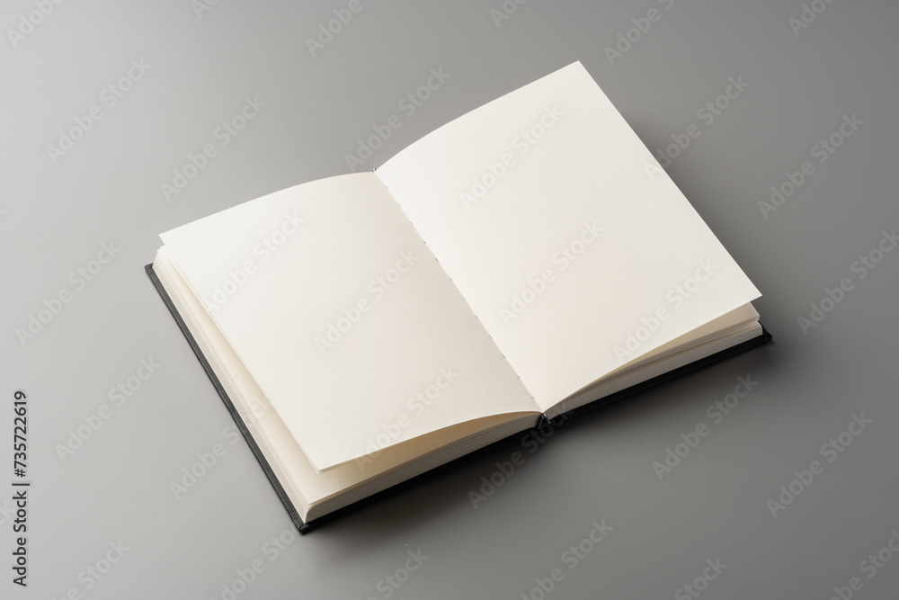 Blank notepad on gray background studio shot Blank notepad on gray background studio shot