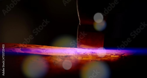 Welding of metal structures with sparks, close-up.