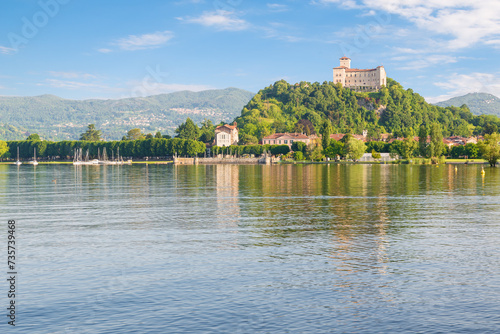 Lake Maggiore with the city of Angera and the castle or Rocca of Angera (fortress of Angera) on the hill, built between the eleventh and seventeenth centuries. Italy
