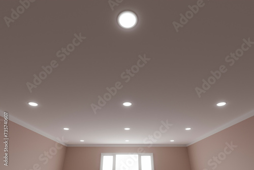 Recessed ceiling lights in a white stretch ceiling.