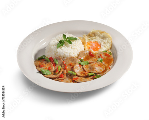 Stir fried basil and meatball on rice with fried egg in white dish on white background