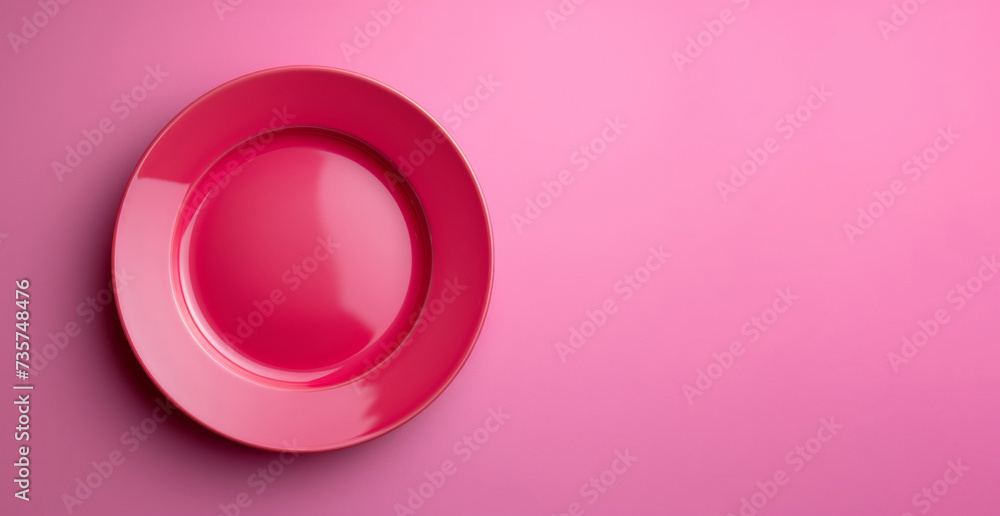 Minimalist Pink Ceramic Plate on a Vibrant Pink Background with Ample Copy Space Minimalist Pink Ceramic Plate on a Vibrant Pink Background with Ample Copy Space