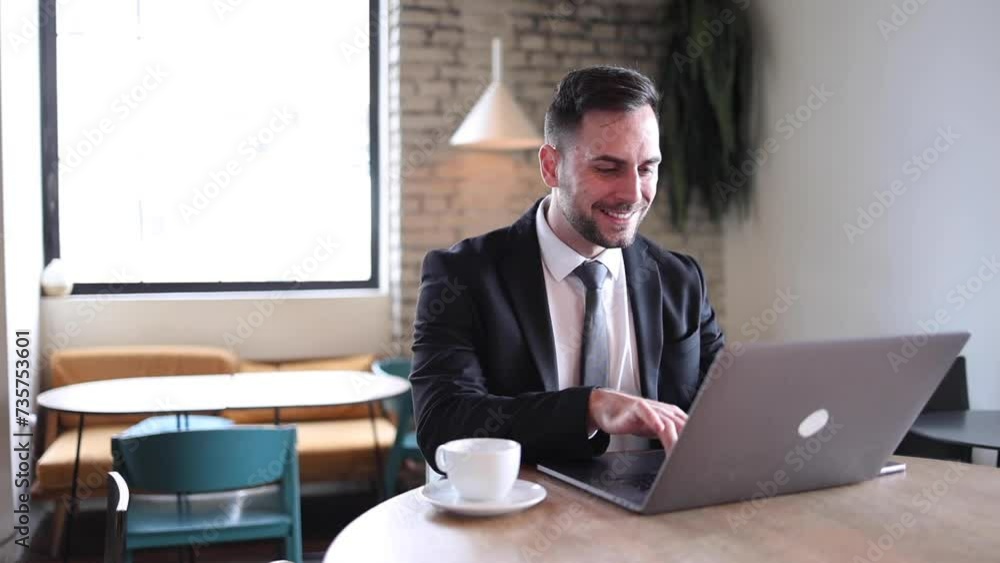 Happy businessman working online from the cafe Happy businessman working online from the cafe