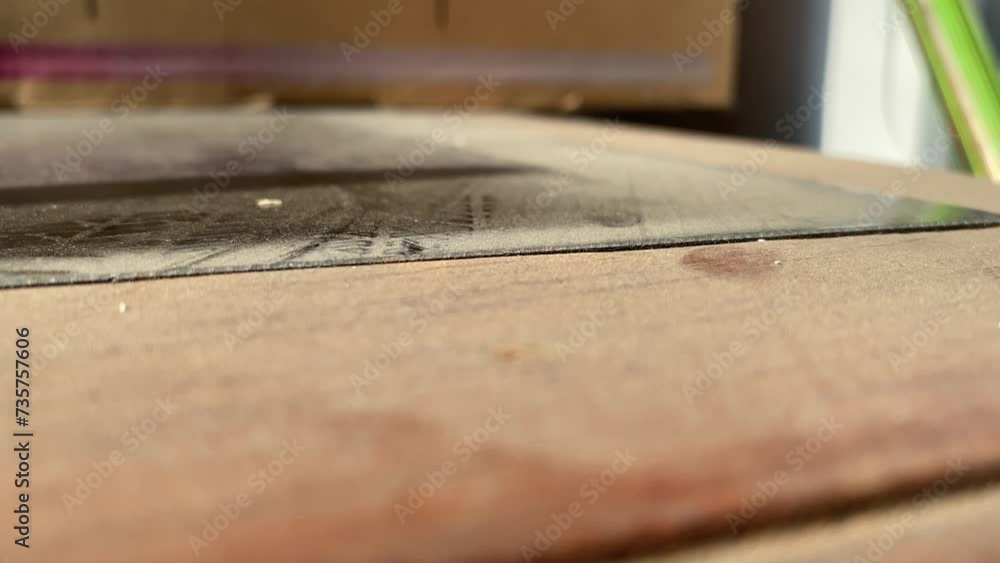 Male finger touch on wooden dirty dusty table top close up view indoor. Hygiene concept Male finger touch on wooden dirty dusty table top close up view indoor. Hygiene concept
