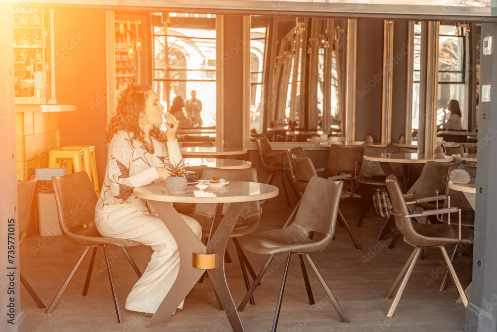 Woman cafe coffee breakfast. Portrait of an adult beautiful woman in an elegant suit in a cafe Woman cafe coffee breakfast. Portrait of an adult beautiful woman in an elegant suit in a cafe