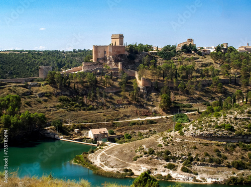 Panoramic view of the monumental town of Alarcon at the foot of the small Henchidero dam. Cuenca, Castile and La Mancha, Spain. photo