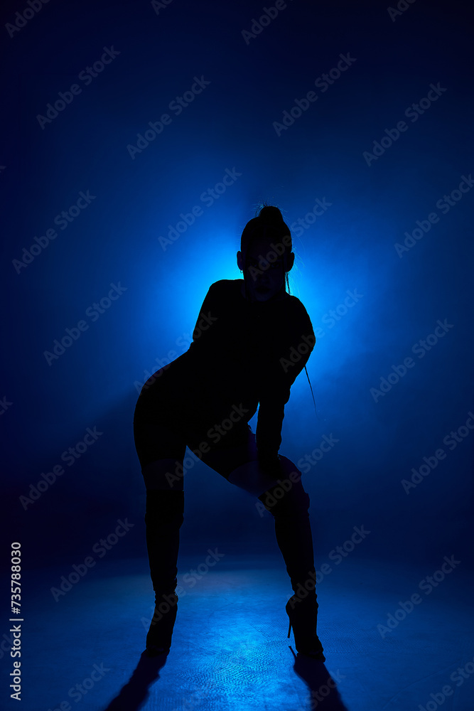 Freedom. Dancing in blue dark room. Sexy woman's portrait on isolated background in smoky neon. passionate model. Concept of human emotions, performance, dance, go go dance, fashion. Motion, action Freedom. Dancing in blue dark room. Sexy woman's portrait on isolated background in smoky neon. passionate model. Concept of human emotions, performance, dance, go go dance, fashion. Motion, action