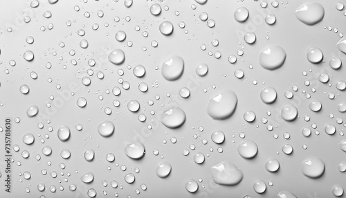 Many water drops on white background, top view