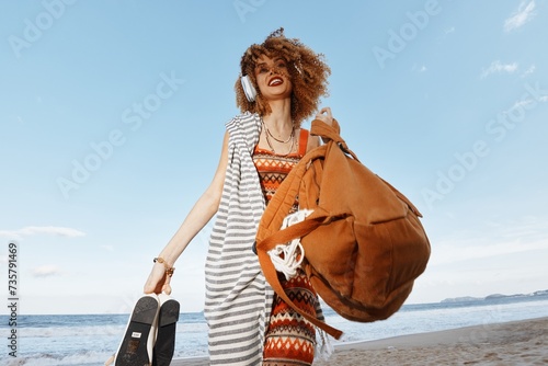Summer Bliss: Smiling Woman Embracing Freedom and Happiness on the Beach