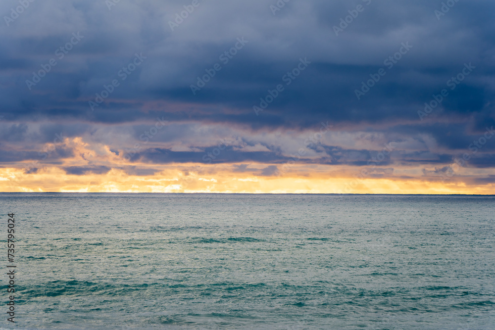Golden horizon over the ocean at sunset. Robe, South Australia