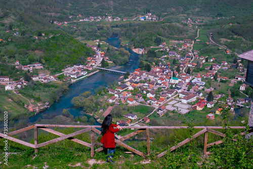 The magnificent panoramic view of the mountain valley of Una river and traditional village Kulen Vakuf from the top of ruined castle Ostrovica photo