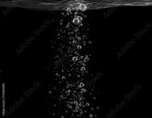 Air bubbles in water on black background