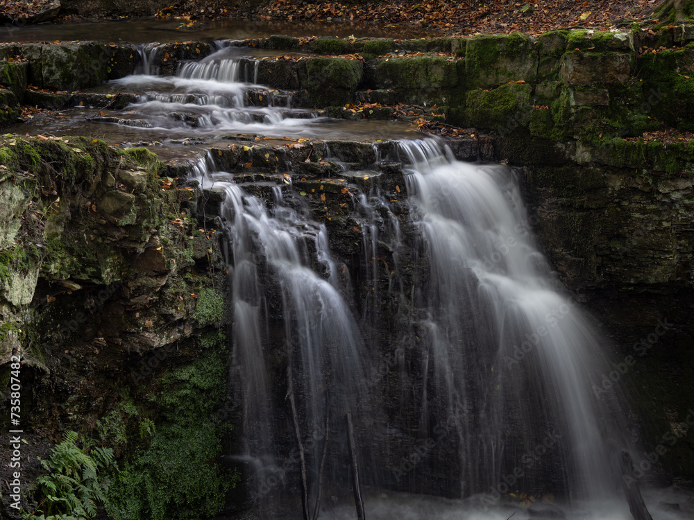 Fototapeta premium The waterfall in green forest.