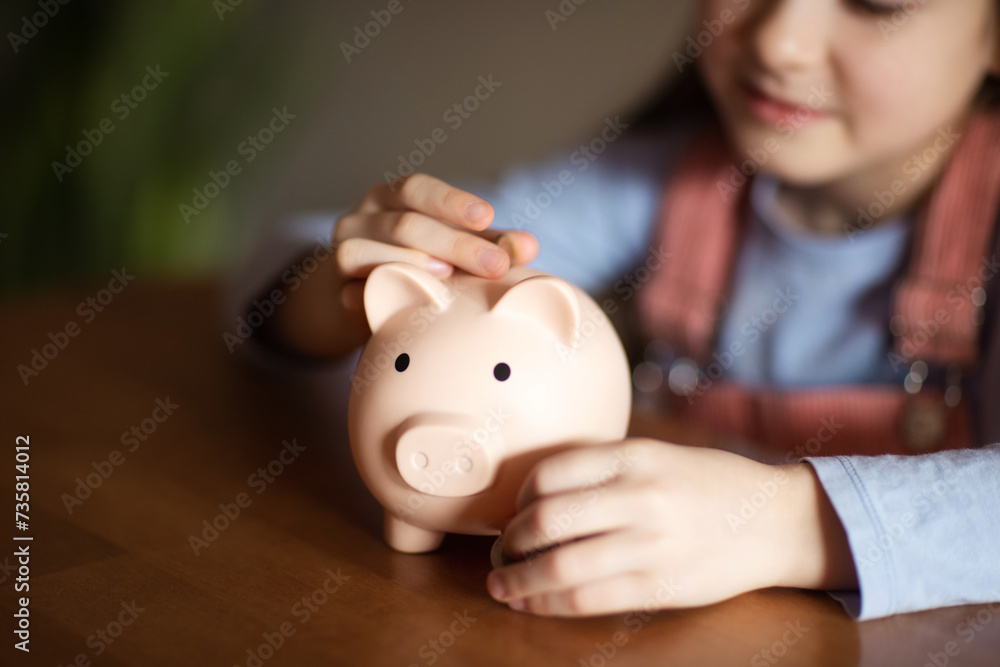 child holding pig piggy bank. concept of saving money, investments, loans to families, deposits for education child holding pig piggy bank. concept of saving money, investments, loans to families, deposits for education