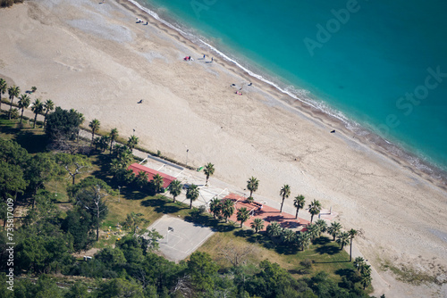 Wallpaper Mural Aerial drone view of the Sarisu beach in Antalya (Turkey) - coastline with palm trees, sand and basketball playground - tropical vacation resort Torontodigital.ca