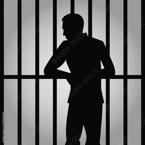 silhouette of a prisoner behind bars