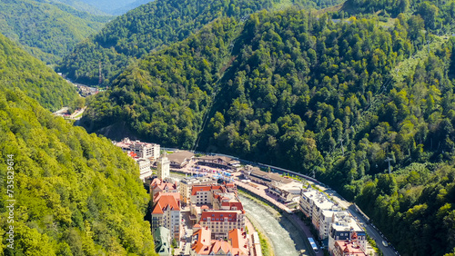 Sochi, Russia - September 10, 2021: Town Hall with clock, Rosa Khutor. Summer. Valley of the Mzemta River, Aerial View photo